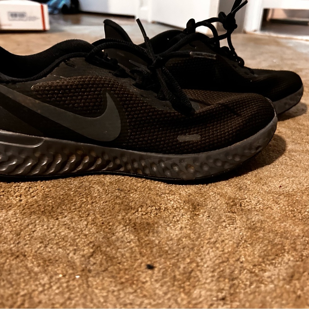 Black Nike running shoes worn once